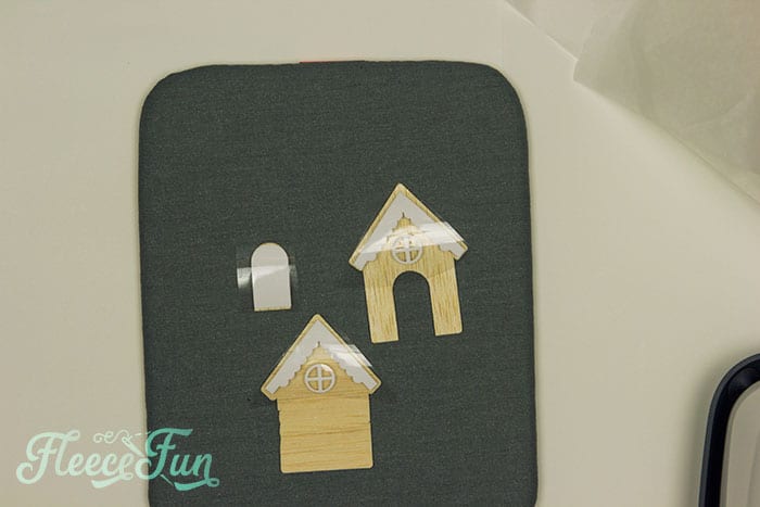 Step-by-step guide to decorating a tiny house with vinyl designs for fleecefun's terrarium project.