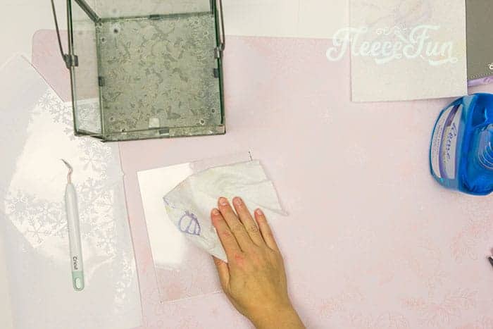 Step-by-step process for adding window cling accents to the lantern in fleecefun's terrarium guide.
