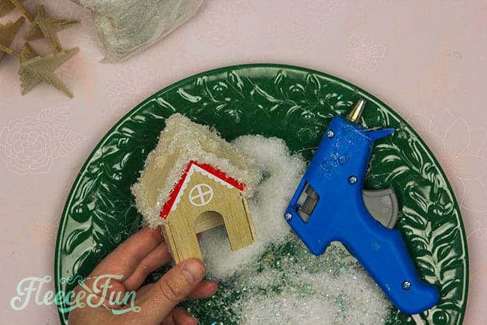DIY miniature house assembly for a festive terrarium crafted with fleecefun's instructions.