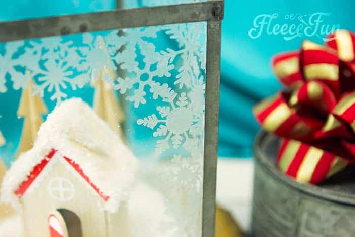 This Christmas Terrarium DIY features wooden elements for a different look. With step by step instructions and lots of pictures this holiday decoration comes together quickly.
