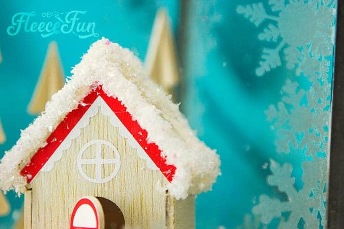 This Christmas Terrarium DIY features wooden elements for a different look. With step by step instructions and lots of pictures this holiday decoration comes together quickly.