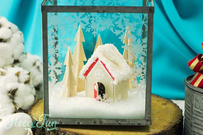 This Christmas Terrarium DIY features wooden elements for a different look. With step by step instructions and lots of pictures this holiday decoration comes together quickly.