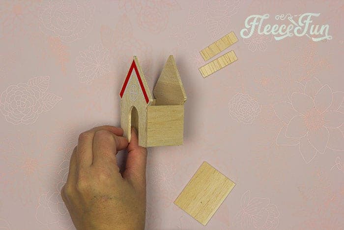 Assembling a miniature house for a Christmas terrarium following fleecefun's free tutorial.