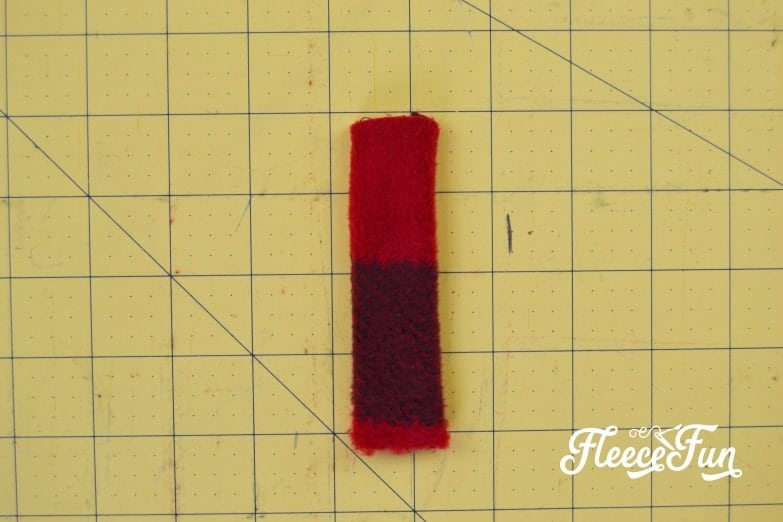 Making a fleece ring by turning the small tube right side out, part of fleecefun's DIY ear warmer headband.