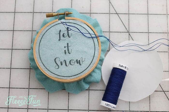 This Let it Snow Embroidery Hoop Ornament DIY makes a wonderful addition to your Christmas tree. Easy step by step instructions and free pattern make this Handmade Ornament a great Christmas craft.