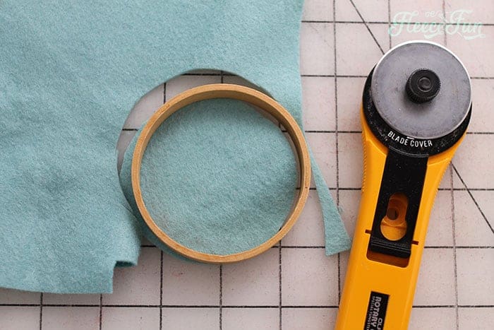 Step 1 of the embroidery hoop ornament: preparing and cutting felt using fleecefun's free template and tutorial.