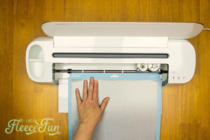 Cutting heat transfer vinyl using the Let Us Sew SVG file from fleecefun