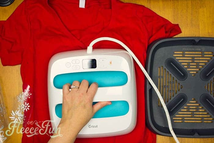 Applying the Let Us Sew design to a holiday shirt using fleecefun's free SVG and guidance