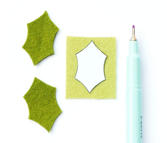 Sewing holly leaf accents for the Noël hoop ornament with fleecefun's step-by-step guide.
