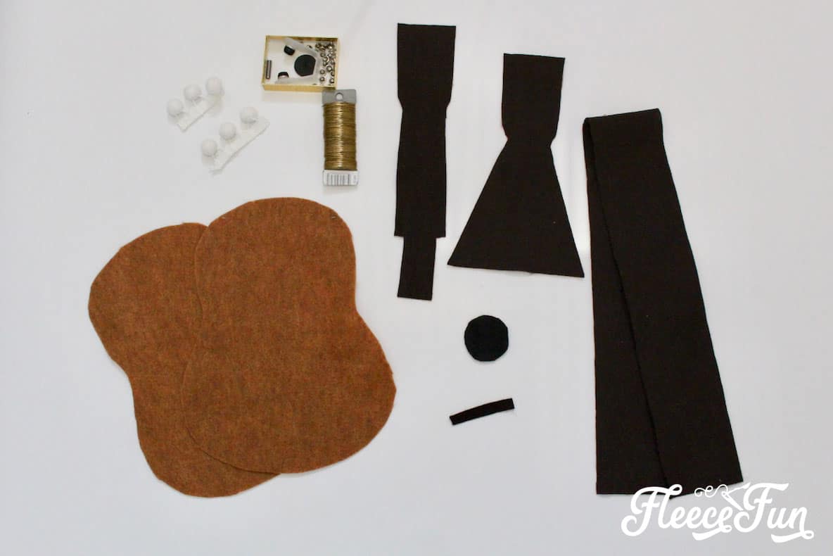 Cutting the felt guitar pattern. This Fun Felt Guitar Softie Toy is the perfect addition to your little one's toy collection. With a vintage look, this free softie toy pattern make a perfect handmade gift. Easy to follow step by step pictures and instructions.