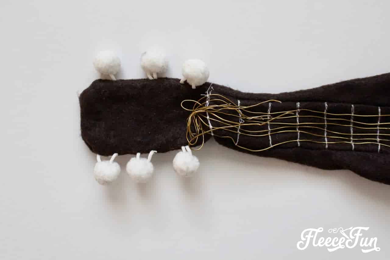 Sew the Neck Pieces Together. This Fun Felt Guitar Softie Toy is the perfect addition to your little one's toy collection. With a vintage look, this free softie toy pattern make a perfect handmade gift. Easy to follow step by step pictures and instructions.
