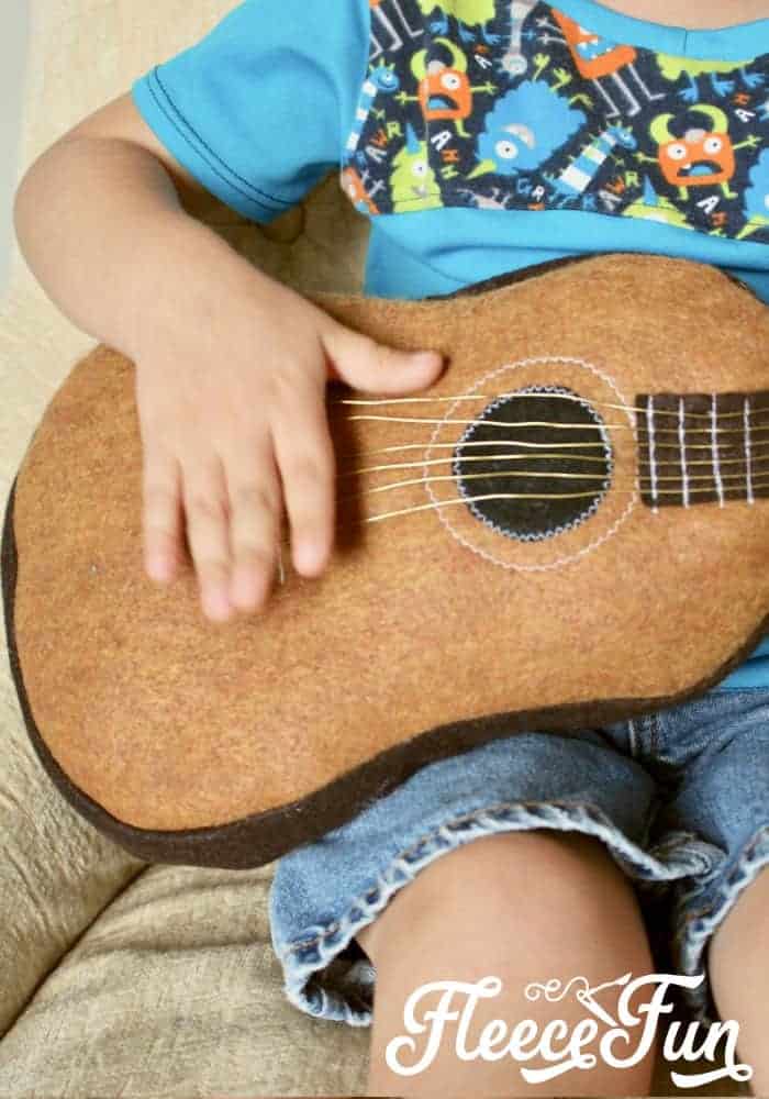 I love this Fun Felt Guitar Softie Toy. This Fun Felt Guitar Softie Toy is the perfect addition to your little one's toy collection. With a vintage look, this free softie toy pattern make a perfect handmade gift. Easy to follow step by step pictures and instructions. #sewingproject #softiespatternsfree #handmadegiftidea #easysewingproject #feltsewingproject