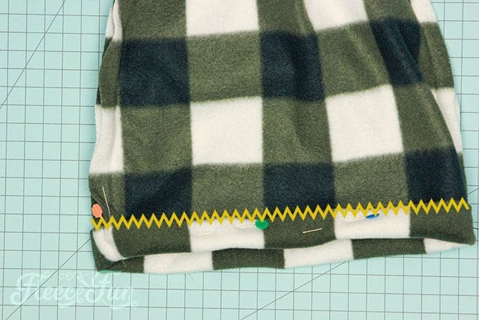 sewing a zig zag stitch over the brim