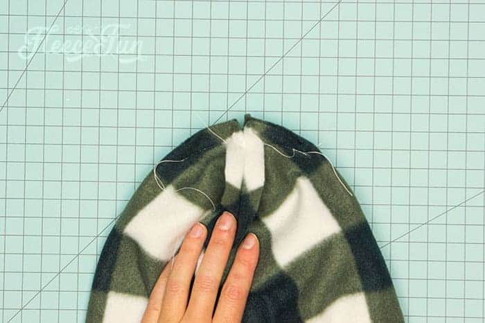pinning and sewing the v on each side closed