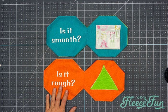 Bringing together the finished soft baby book pages with fleecefun free template and tutorial