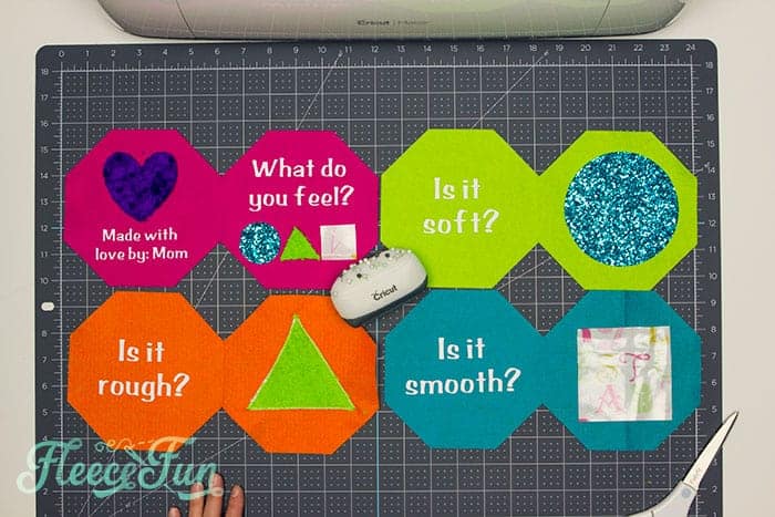 placing the fabric shapes on the felt pages