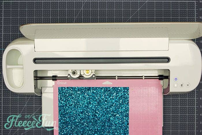Soft baby book fabric pieces arranged before assembly with fleecefun free template and tutorial