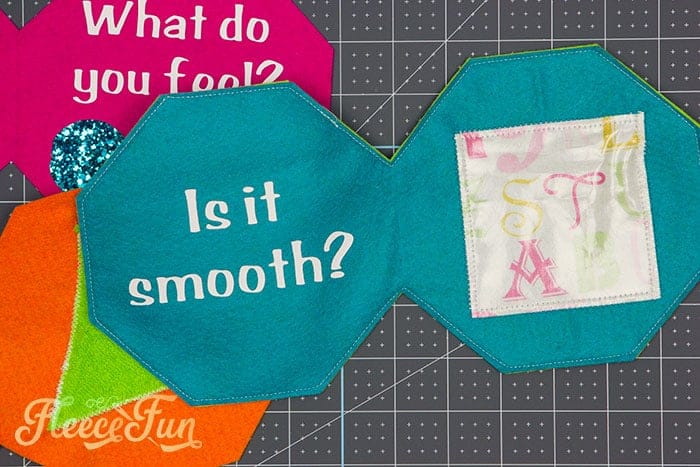 Sewing fabric pages for a handmade softie book baby toy with fleecefun free template and tutorial