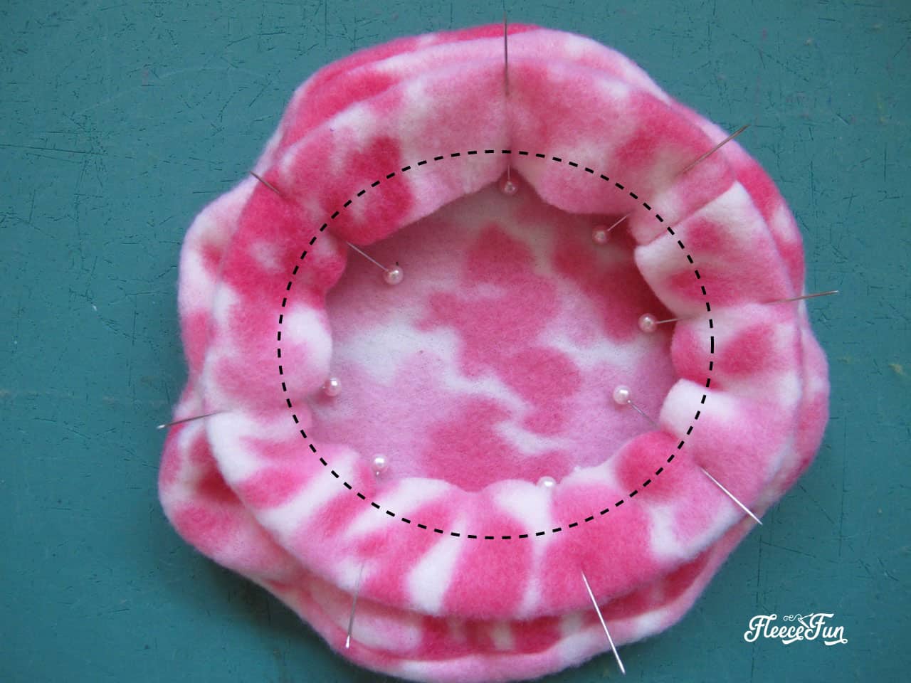 Stitching the seams of a DIY doll hat using Fleece Fun’s free pattern for a perfect fit