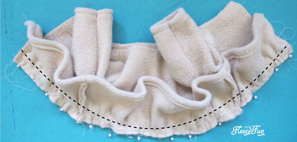 Creating a beautifully tailored doll peplum coat using a free sewing pattern from Fleece Fun