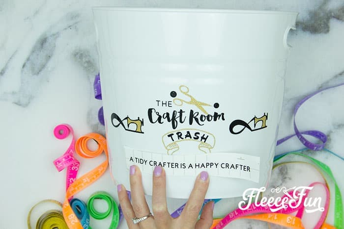 completing the design - Cute Trash Can DIY for your craft space. Make your craft room tidy and cute with this fun to craft trash can. Beautiful step by step photos make it easy.