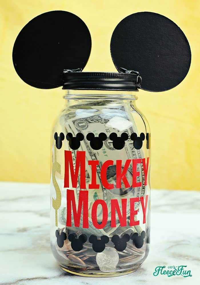 I love this Saving for Disney DIY Disney Savings Jar. Such a cute Mickey craft makes it fun for kids (and adults) to save for a Disney trip!. Easy craft that comes together quickly.