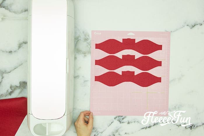 DIY Disney savings jar pieces laid out for assembly with fleecefun and free template and tutorial