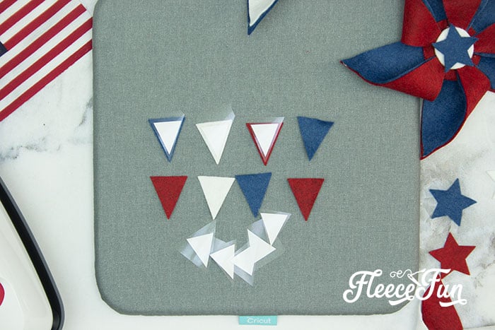 There’s just something about red, white, and blue on the front door that makes summer feel official. This DIY Pinwheel Wreath is bold, cheerful, and packed with patriotic charm without looking store-bought. Made with felt pinwheels and a free SVG file, it’s sturdy enough to survive garage mishaps and cute enough to steal the spotlight at your 4th of July party. Ready to spin some Americana magic into your home decor?