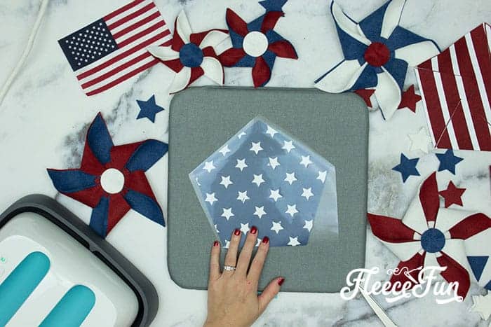 Make this Americana Decor DIY Patriotic Pinwheel Wreath. Download the FREE project file and follow the beautiful step by step photos and instructions.