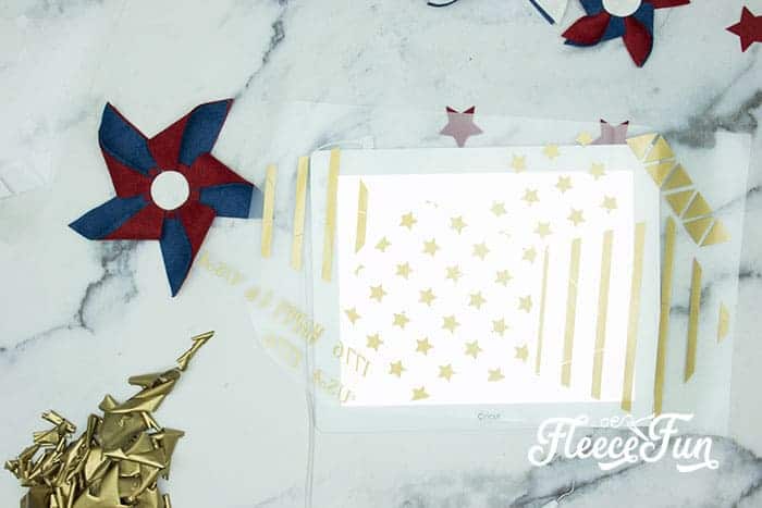Weeding the HTV. There’s just something about red, white, and blue on the front door that makes summer feel official. This DIY Pinwheel Wreath is bold, cheerful, and packed with patriotic charm without looking store-bought. Made with felt pinwheels and a free SVG file, it’s sturdy enough to survive garage mishaps and cute enough to steal the spotlight at your 4th of July party. Ready to spin some Americana magic into your home decor?