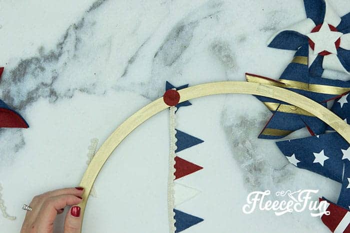 There’s just something about red, white, and blue on the front door that makes summer feel official. This DIY Pinwheel Wreath is bold, cheerful, and packed with patriotic charm without looking store-bought. Made with felt pinwheels and a free SVG file, it’s sturdy enough to survive garage mishaps and cute enough to steal the spotlight at your 4th of July party. Ready to spin some Americana magic into your home decor?