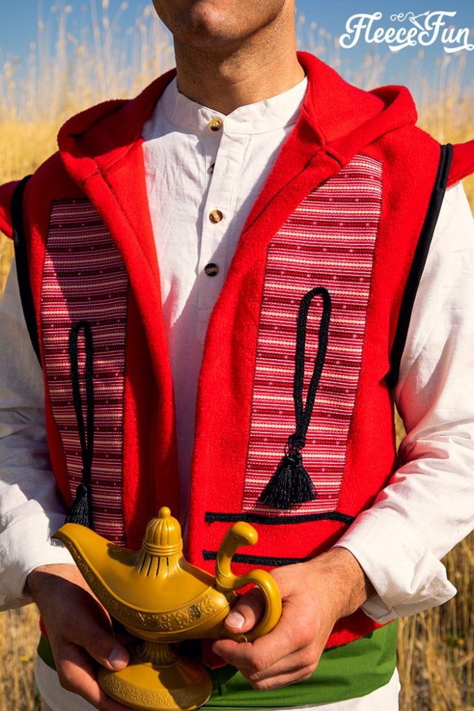 This Aladdin costume DIY is inspired by the Vest from the 2019 movie! Use this free pattern to make a hoodie vest just like Aladdin's.