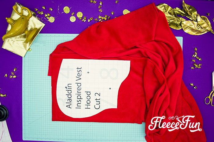 This Aladdin costume DIY is inspired by the Vest from the 2019 movie! Use this free pattern to make a hoodie vest just like Aladdin's.