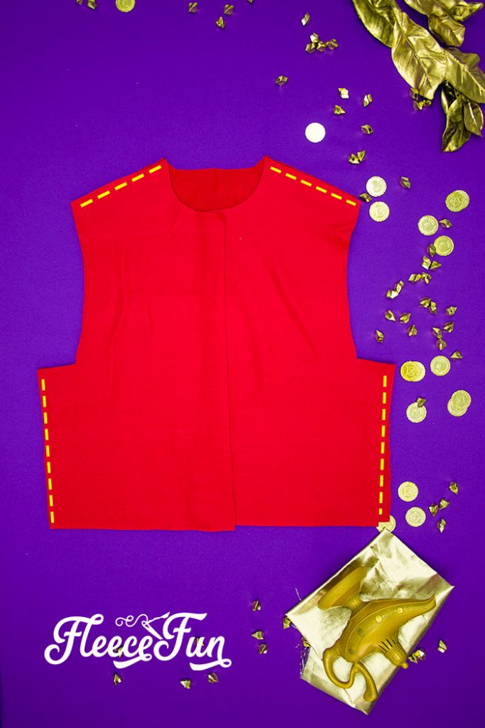 This Aladdin costume DIY is inspired by the Vest from the 2019 movie! Use this free pattern to make a hoodie vest just like Aladdin's.