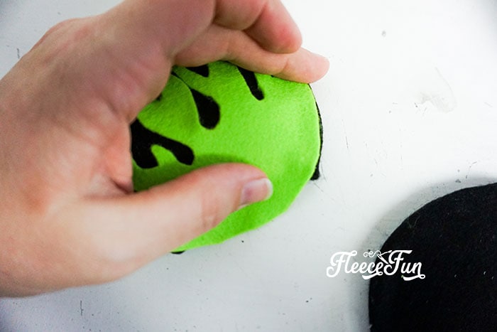 Affix the bright green felt flame cutout t.