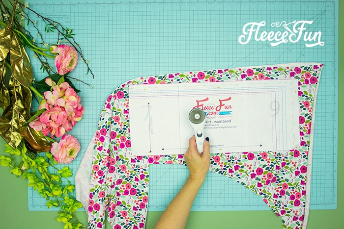 Getting started on the handmade girl's skirt by cutting fabric with the fleecefun free pattern