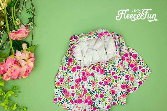 Finalizing the handmade circle skirt by securing the waistband with the fleecefun pattern