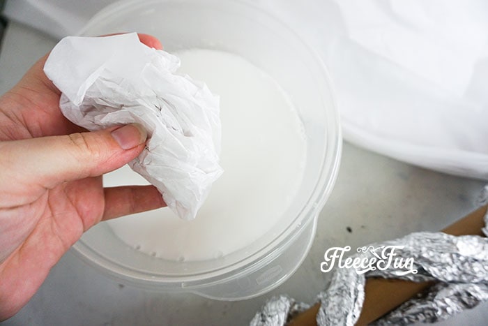 Mixing glue with water.
