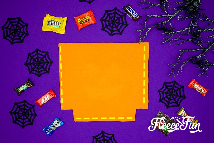 Complete the base of your Halloween treat bag by sewing with fleecefun’s instructions