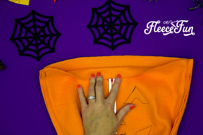 Finishing the top edge of your Halloween candy bag with fleecefun’s free sewing guide