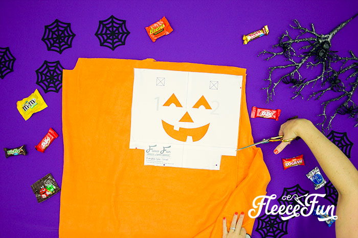 Preparing fabric pieces for a Halloween treat bag using fleecefun's free pattern