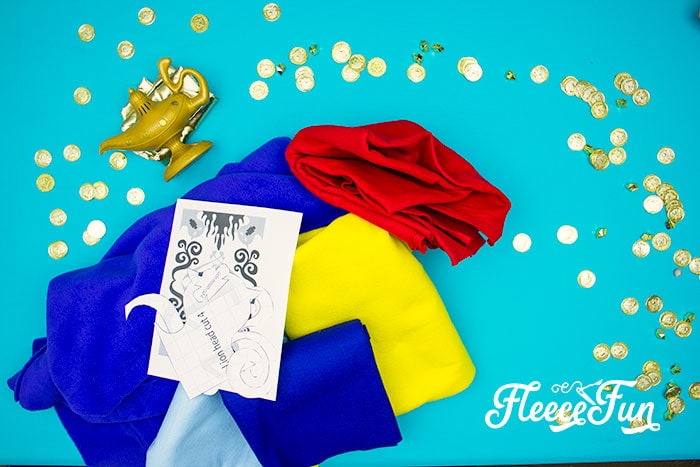 Cutting fabric pieces for the DIY Magic Carpet costume using fleecefun free template and tutorial.