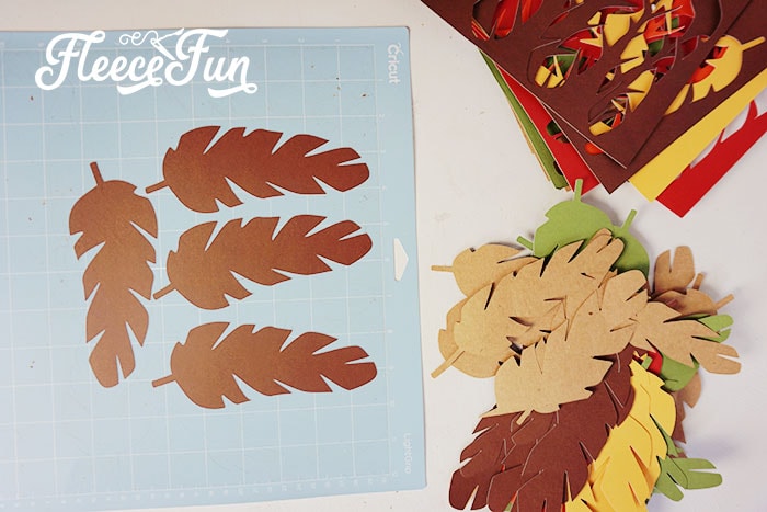 Learn to cut out the banner elements in step 1 of FleeceFun's Thanksgiving banner tutorial