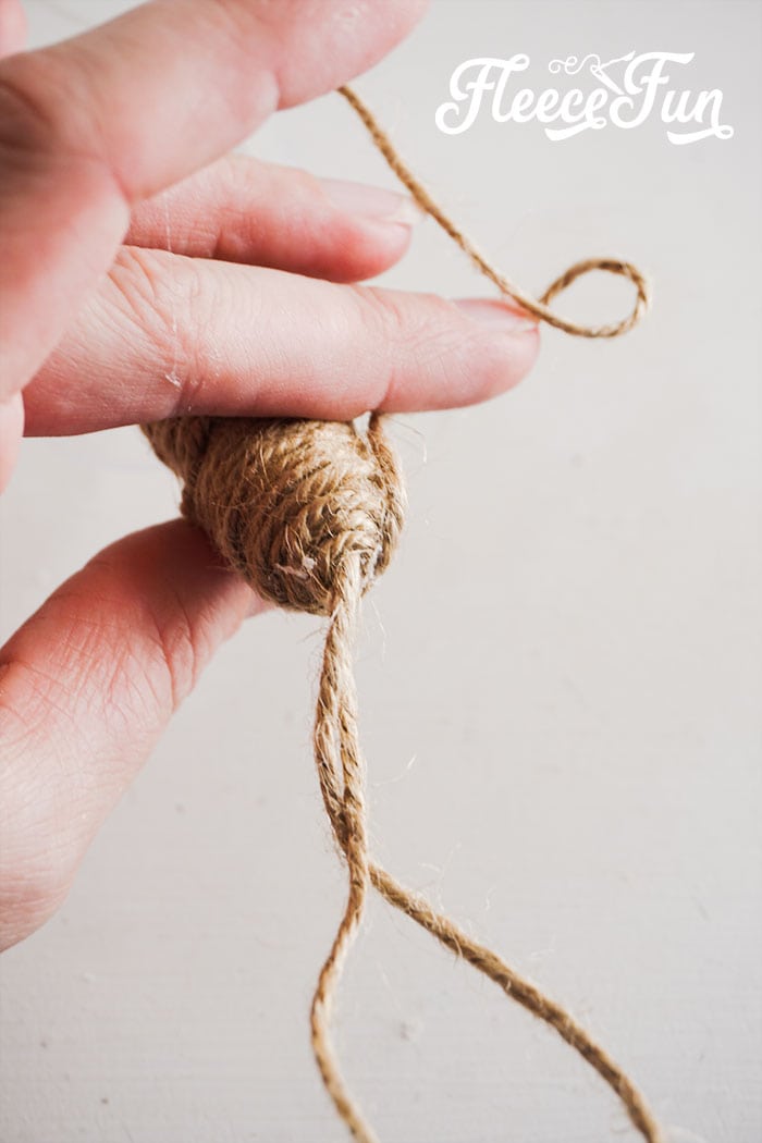 wrapping the twine around the wine glass