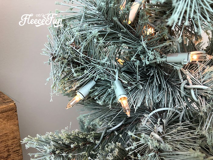 Pre-lit tree's final look after removing light covers, following fleecefun’s free instructions.