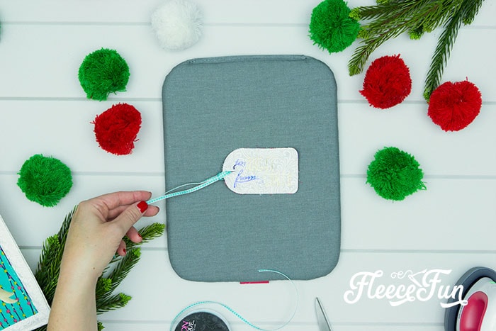adding a ribbon to the tag