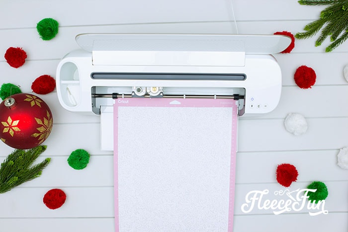 Cutting fabric pieces for holiday placemat with fleecefun’s free template and tutorial