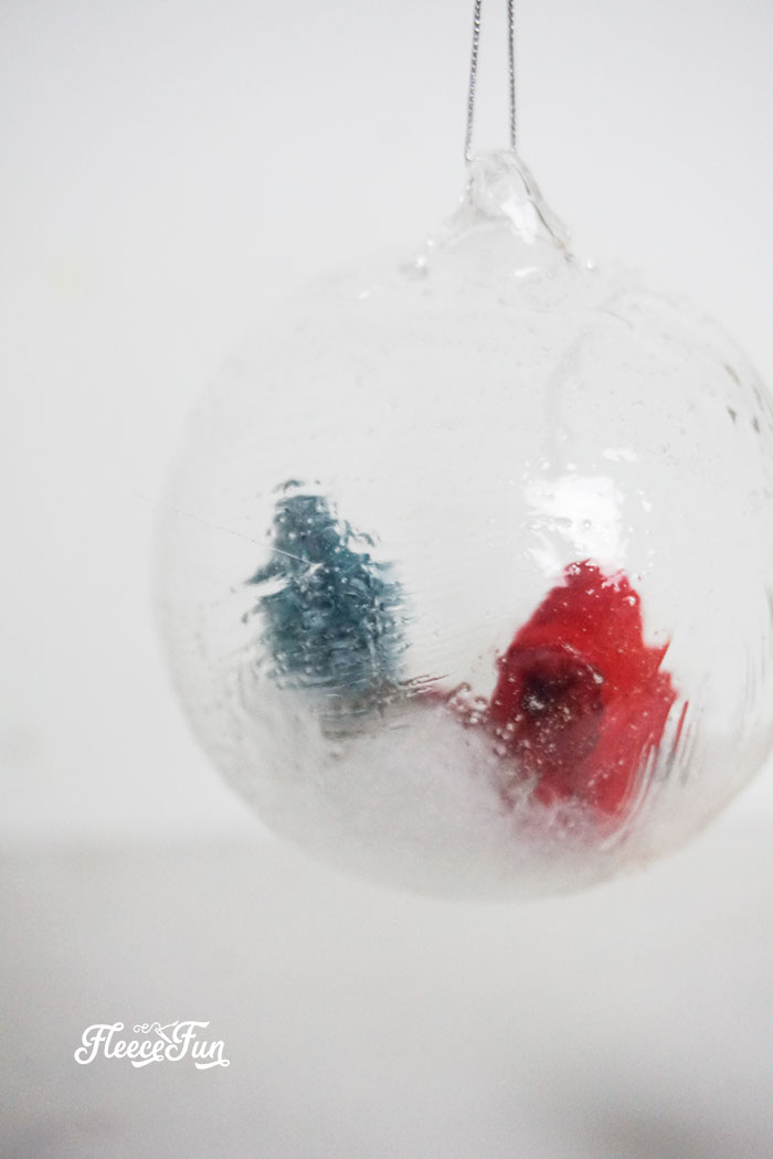 placing the finished gnomes inside the ornament
