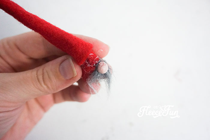 affixing the nose of the gnome
