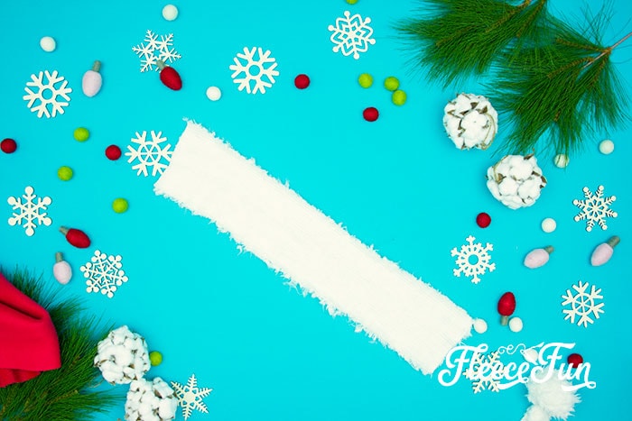 Sewing the pieces of the Santa hat together following fleecefun’s free template and tutorial